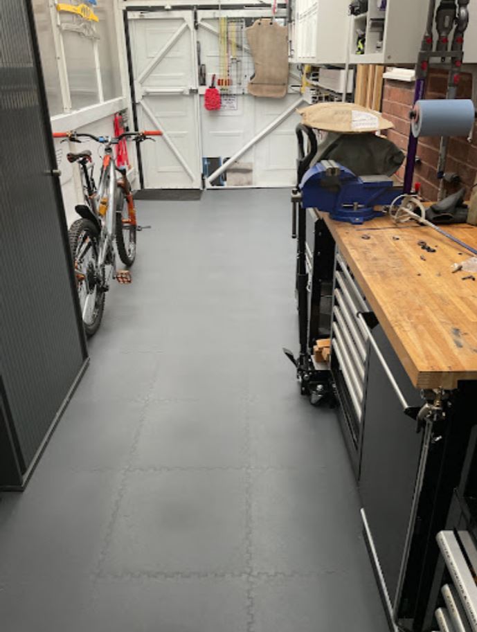 A home utility room transformed into a workshop with interlocking pvc garage floor tiles