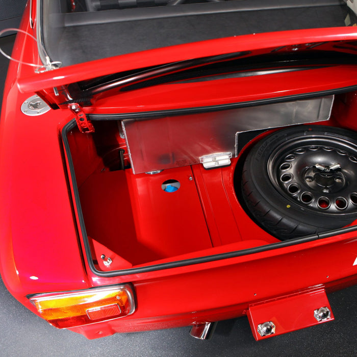 Image of rear of vehicle on spekcled tiles