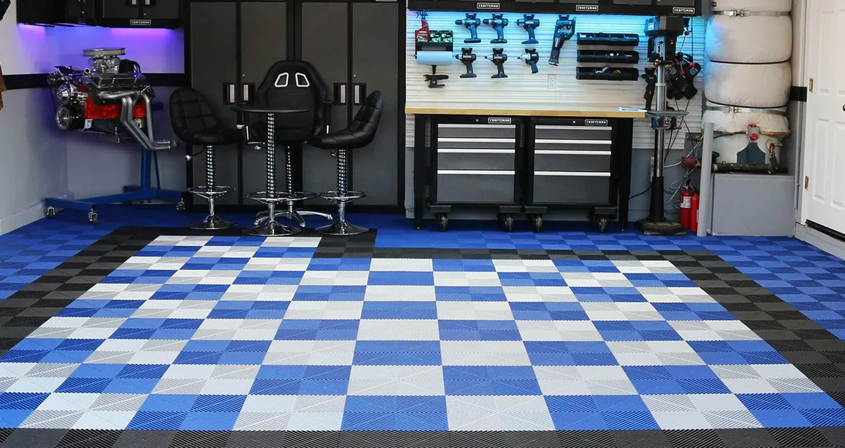 Photo of swisstrax vented garaage floor tiles in the floor of a garage workshop