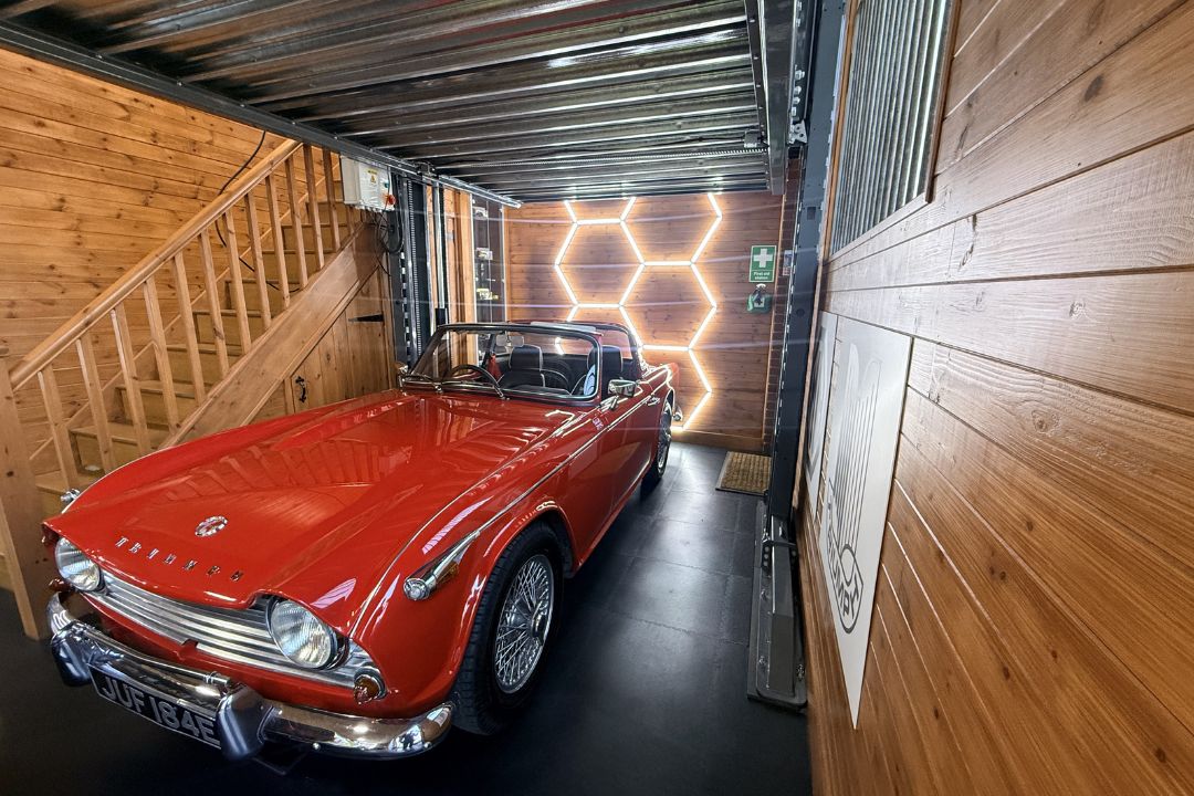 Red triumph on black garage flooring tiles