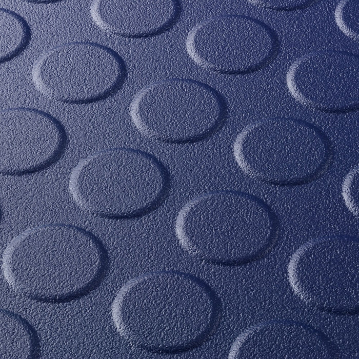 Close up of a Blue T Joint interlocking Ecotile floor tile with Raised Disc surface finish