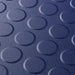 Close up of a Blue T Joint interlocking Ecotile floor tile with Raised Disc surface finish
