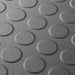 Close up of a Dark Grey T Joint interlocking Ecotile floor tile with Raised Disc surface finish