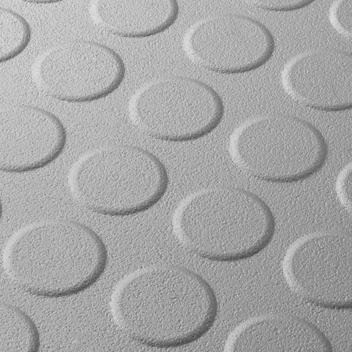Close up of a Light Grey T Joint interlocking Ecotile floor tile with Raised Disc surface finish