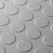 Close up of a Light Grey T Joint interlocking Ecotile floor tile with Raised Disc surface finish